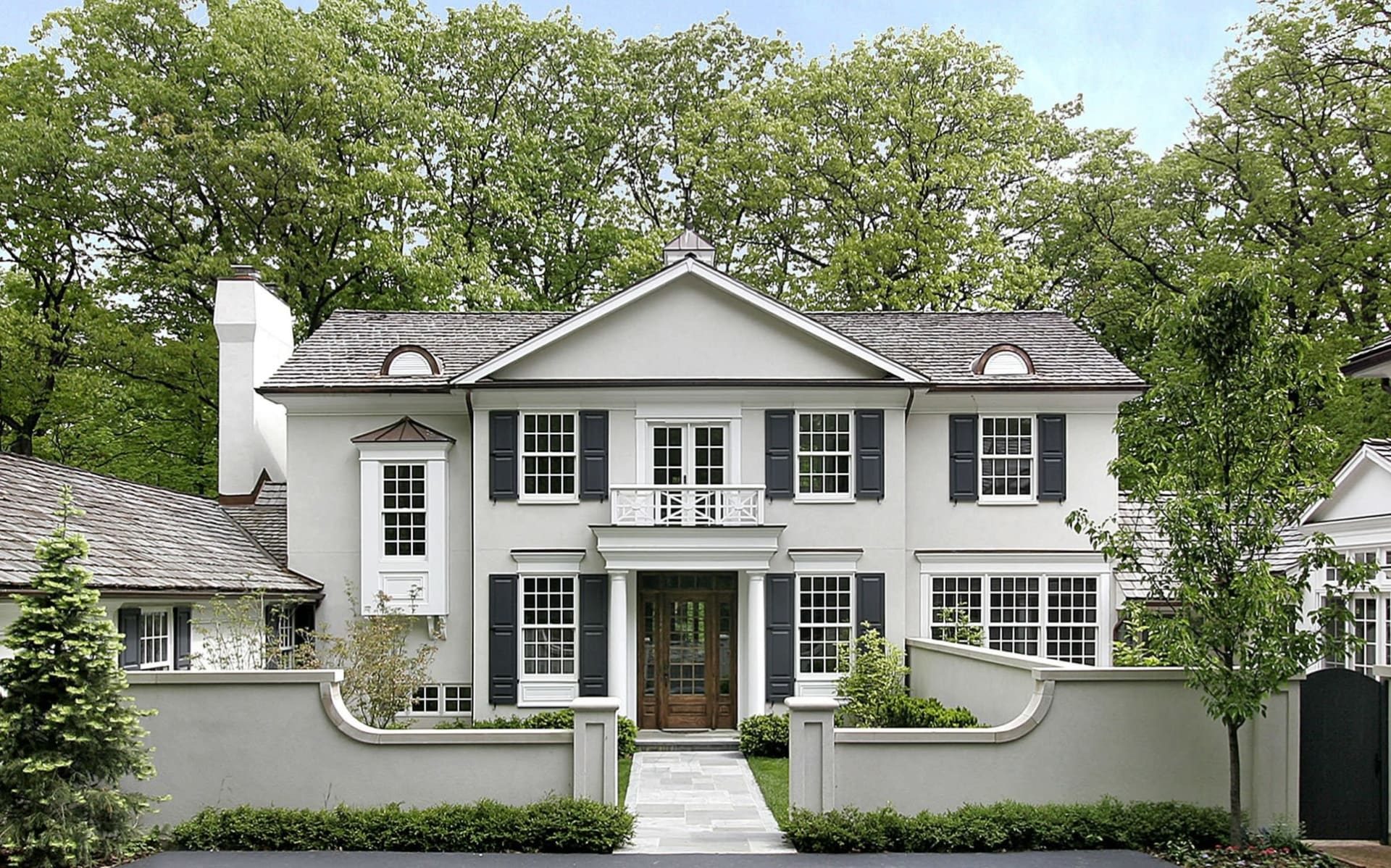 White colonial home with formal entry